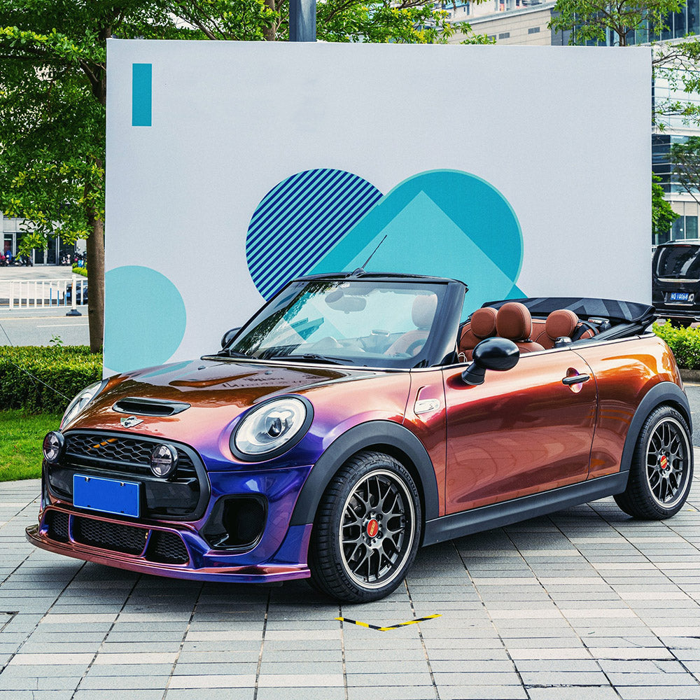 Mini Cooper convertible wrapped in TeckWrap Purple Sunset chameleon film, highlighting a playful and premium purple-to-orange transition.