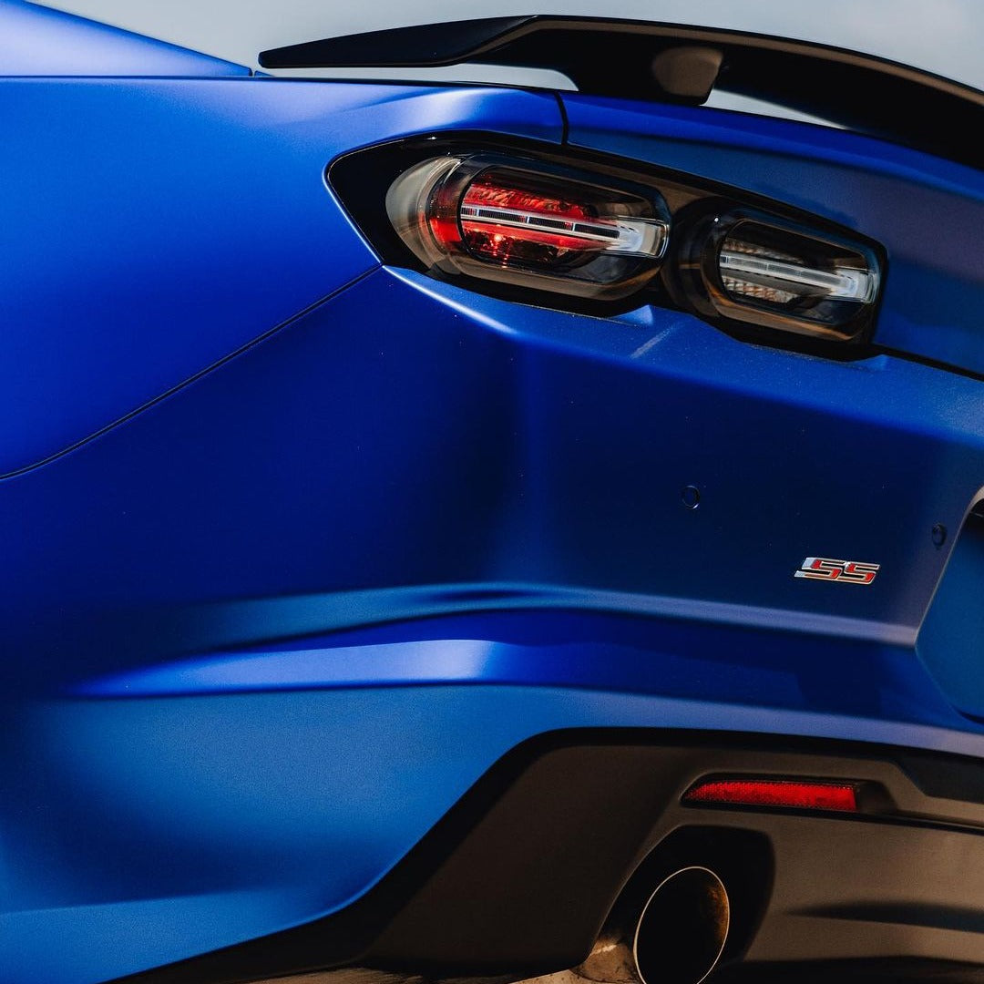 Detailed Rear Corner of Chevrolet Camaro Highlighting TeckWrap Rasant Blue (SMT07) Satin Finish