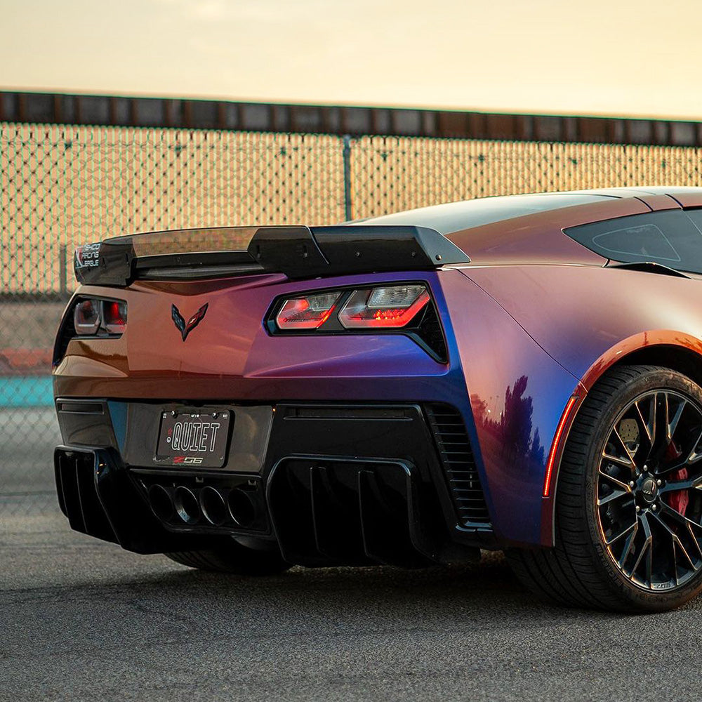 Rear view of a Corvette Z06 wrapped in TeckWrap Purple Sunset (RD20PRO-HD) vinyl, featuring a stunning metallic gradient finish.