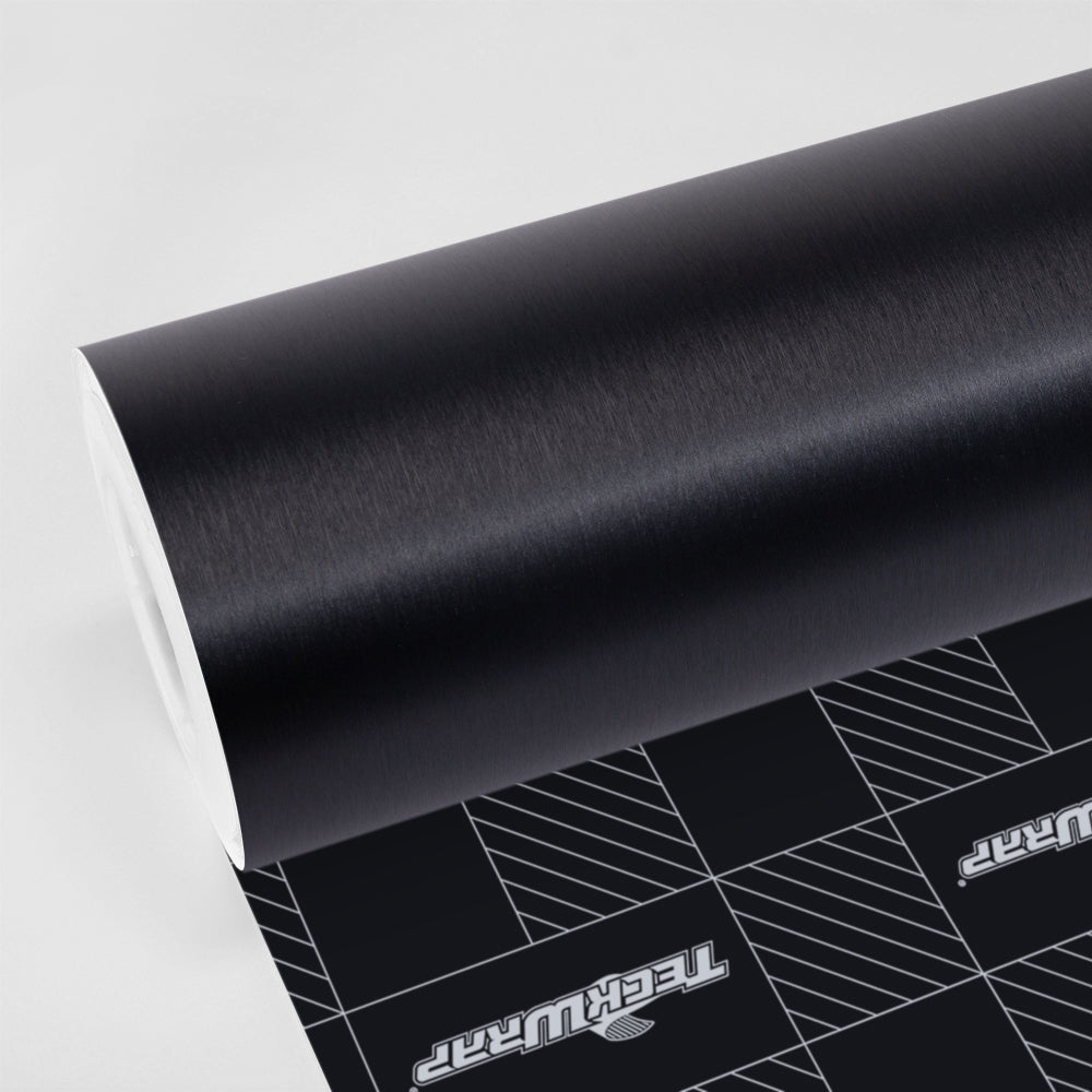 Close-up view of TeckWrap Brushed Black (BM04) vinyl wrap roll, highlighting its refined brushed metallic texture.