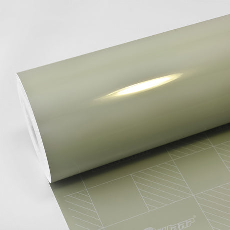Moss Green CG23-HD Glossy Vinyl Wrap roll by TeckWrap, showcasing its sleek olive tone and high-gloss finish on branded release liner.