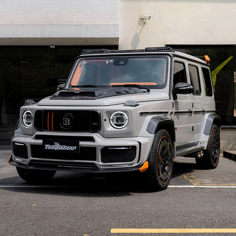 Front view of a modified Brabus G-Class SUV featuring TeckWrap Vintage Grey (CG47-HD) high-gloss vinyl wrap.