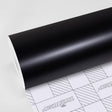 TeckWrap Raven Black CM14 matte vinyl wrap roll with branded grid liner, ideal for sleek car wrap finishes
