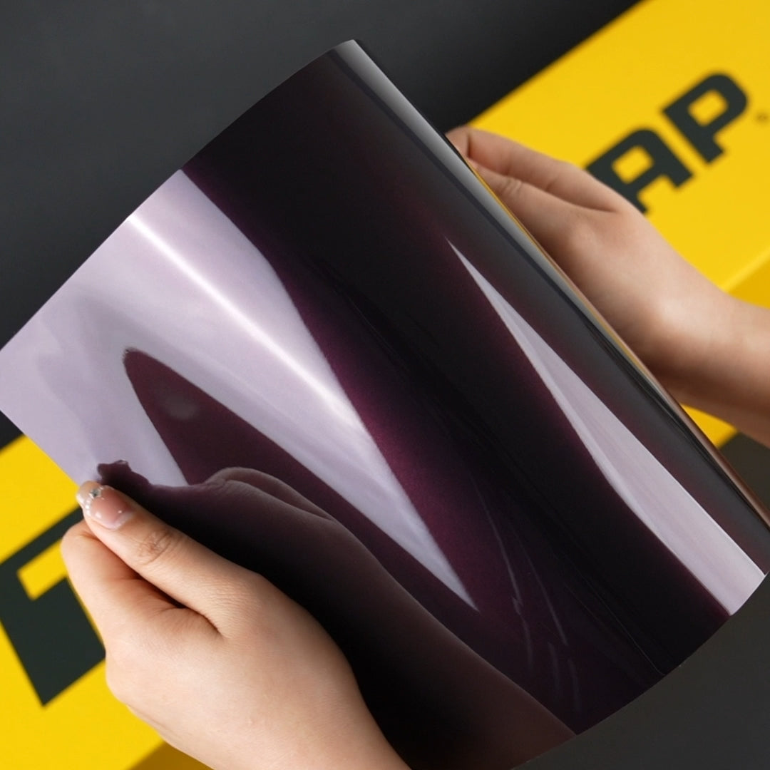 Hands Holding TeckWrap A4 Sample of SMT03 Venetian Violet Vinyl Car Wrap