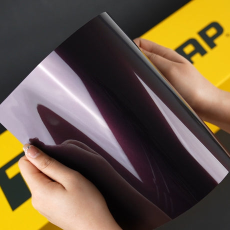 Hands Holding TeckWrap A4 Sample of SMT03 Venetian Violet Vinyl Car Wrap
