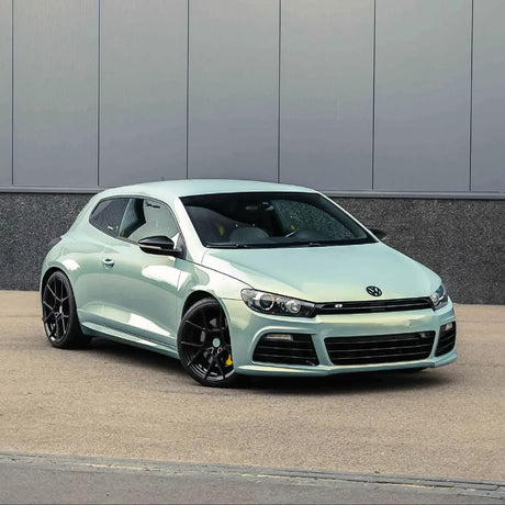 Volkswagen Scirocco wrapped in TeckWrap Palladian Blue gloss vinyl parked on street