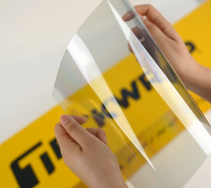 Hands showing sample of SC70-3mil Car Window Tint Film by Teckwrap