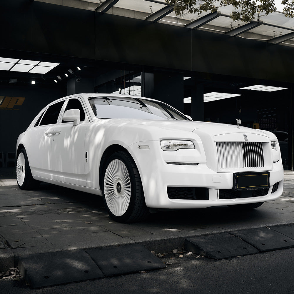 Luxury car fully wrapped in TeckWrap Alaska White SCM02 matte vinyl, demonstrating sleek, elegant, and professional-grade finish