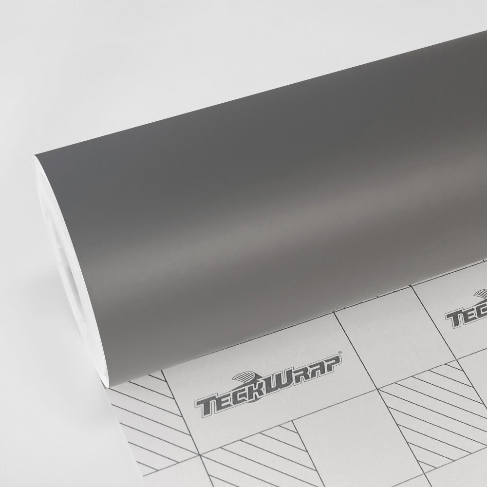 Close-up of TeckWrap SCM47-R Nickel Grey Super Matte Satin vinyl wrap roll featuring durable matte satin finish and precision-cut backing paper for easy application.