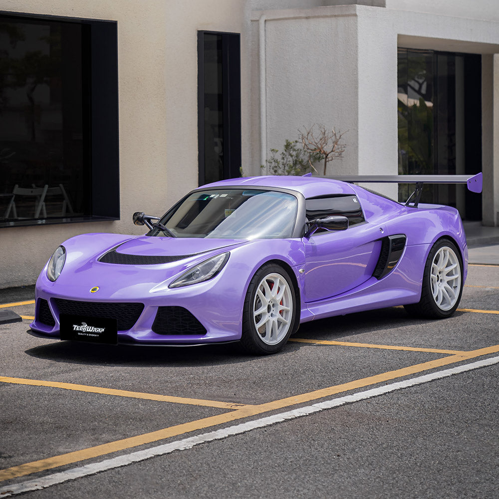 Lotus Exige wrapped in TeckWrap Royal Purple (SL07-HD) gloss vinyl, showcasing sporty design with a smooth, reflective surface.