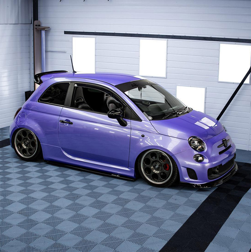 Modified Fiat 500 Abarth with TeckWrap SL07-HD Royal Purple gloss vinyl wrap, parked on custom flooring for show-car appeal.