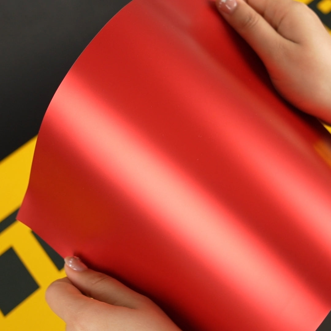 Close up A4 Sample of TeckWrap SMT15 Flame red satin metallic vinyl car wrap