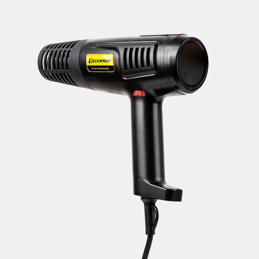 Side view of TeckWrap Standard Heat Gun angled slightly forward, displaying its durable build and precision heat output vent.