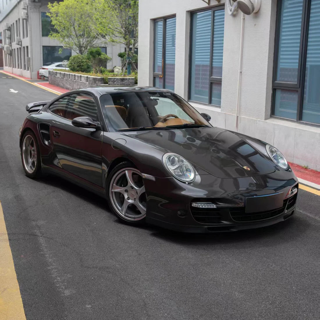 Front view of Porsche in Stone Bronze Gloss Metallic PPF
