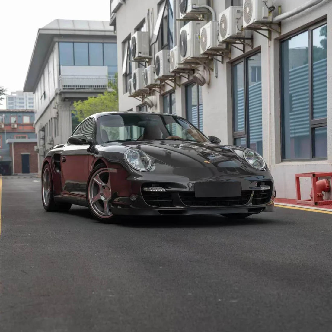 Front view of Porsche in Stone Bronze Gloss Metallic PPF