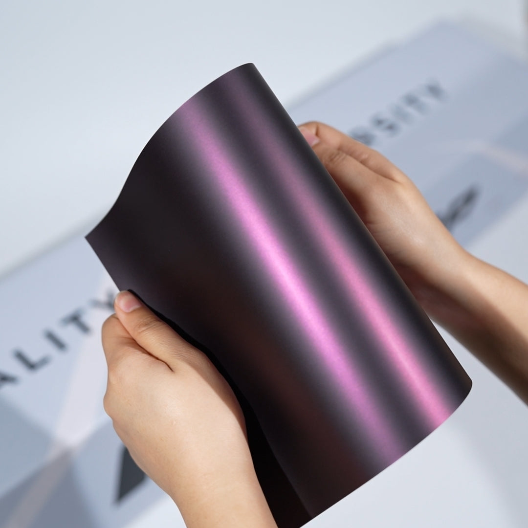 TeckWrap A5 Pearlescent Color PPF sample showing dark black base with soft rose pink metallic glow