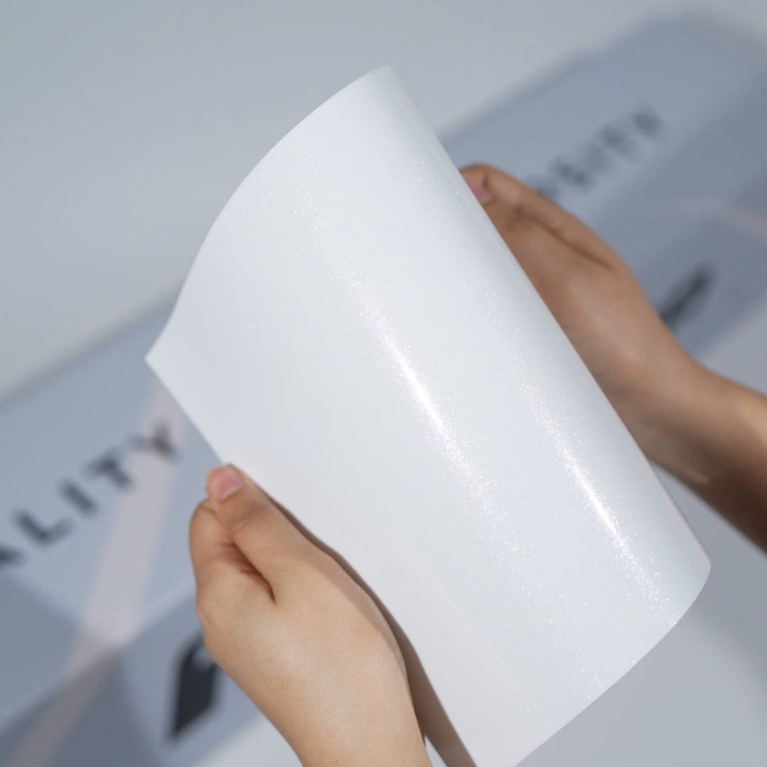 White TeckWrap A5 Pearlescent PPF sample showing fine sparkle and soft glossy reflection