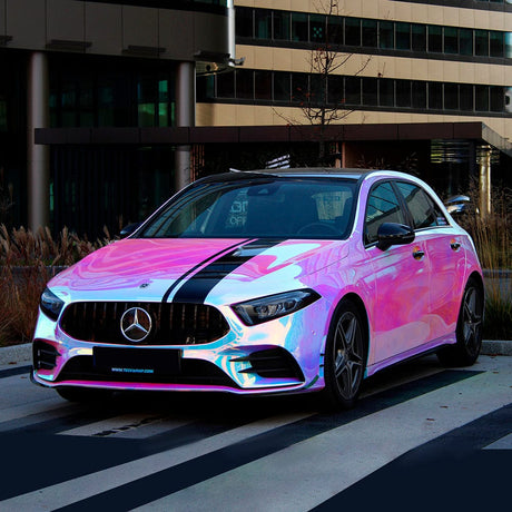 Mercedes-Benz fully wrapped in Purple Blue Aquamarine chrome vinyl wrap, displaying dramatic purple and blue iridescence in an urban setting.