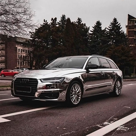 Audi fully wrapped in TeckWrap Chrome White Gold (CHM01-HD) vinyl, demonstrating an impressive mirror-like chrome finish that enhances the vehicle's luxury aesthetic