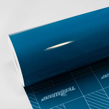 Glossy Avalon Teal (CG33-HD) vinyl wrap roll by TeckWrap, highlighting its deep, lustrous teal finish and smooth reflective surface.