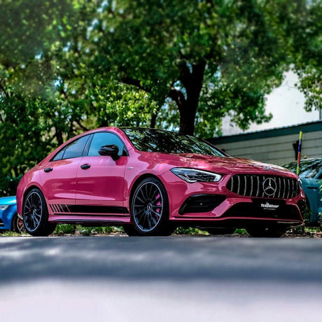 Mercedes-Benz CLA wrapped in TeckWrap Berry Red (CG49-HD) gloss vinyl parked under trees