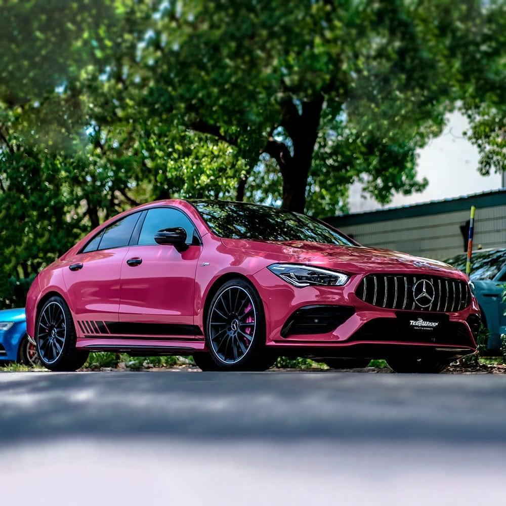 Mercedes-Benz CLA wrapped in TeckWrap Berry Red (CG49-HD) gloss vinyl parked under trees