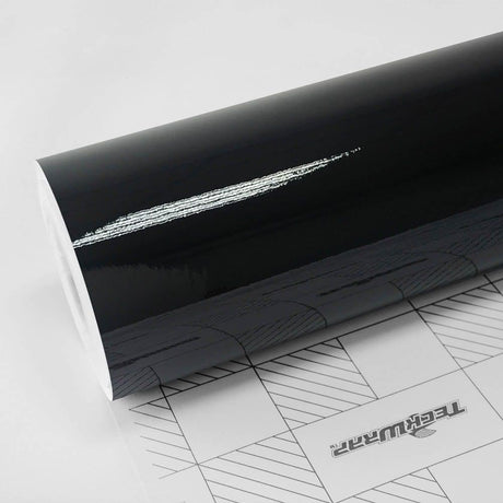 TeckWrap Black Gloss (CG01) vinyl wrap roll showing high-gloss reflective surface and branded backing paper