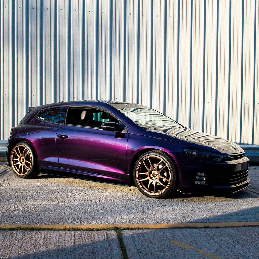 Sporty coupe featuring TeckWrap Gloss Black Cherry Ice (HM08-HD) Vinyl Wrap under sunlight, emphasizing the wrap’s deep, reflective black-cherry hue and smooth gloss texture