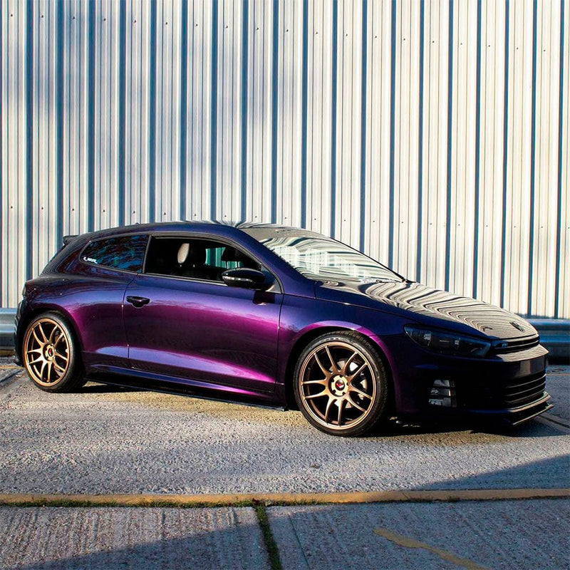 Sporty coupe featuring TeckWrap Gloss Black Cherry Ice (HM08-HD) Vinyl Wrap under sunlight, emphasizing the wrap’s deep, reflective black-cherry hue and smooth gloss texture