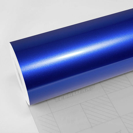 Teckwrap Gloss Blue Gem (GAL02-HD) Vinyl Wrap roll close-up showcasing its glossy finish with vibrant metallic blue hues.