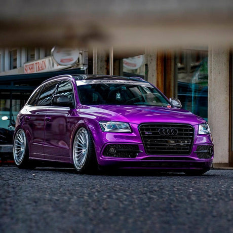Audi vehicle wrapped in Teckwrap Gloss Candy Purple (GAL03-HD) Vinyl, highlighting the wrap's glossy, eye-catching purple finish enhancing the vehicle's sleek aesthetics.