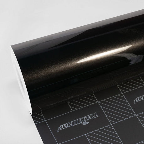 Roll of TeckWrap Gloss Coal Black (MT01-HD) Vinyl Wrap, showcasing its deep, glossy finish and reflective elegance, perfect for sophisticated vehicle customization.