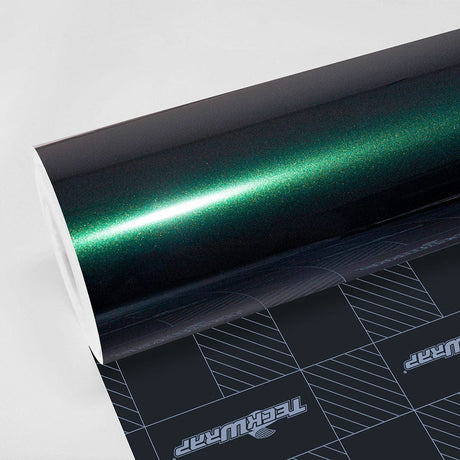 Close-up of TeckWrap Gloss Green Black (HM07-HD) vinyl wrap showcasing a rich, deep green finish with subtle black undertones and a glossy sheen.