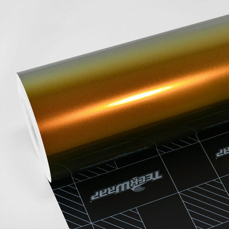 Close-up of TeckWrap Honey Lime (RD12-HD) glossy vinyl wrap roll showcasing its vibrant gold-to-green color shift, reflecting a luxurious metallic sheen.