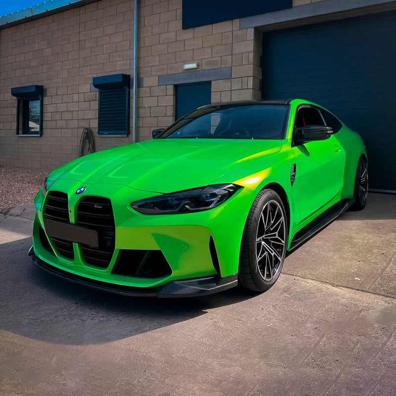 BMW coupe showcased in striking Kelly Green (RB22-HD) vinyl wrap, highlighting its aggressive styling and glossy finish.