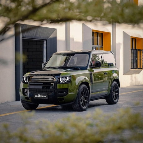 Land Rover Defender wrapped in TeckWrap Khaki Green (CG29-HD) High Glossy Vinyl, showcasing an eye-catching, high-gloss olive green finish paired with black accents — ideal for rugged yet refined vehicle aesthetics.