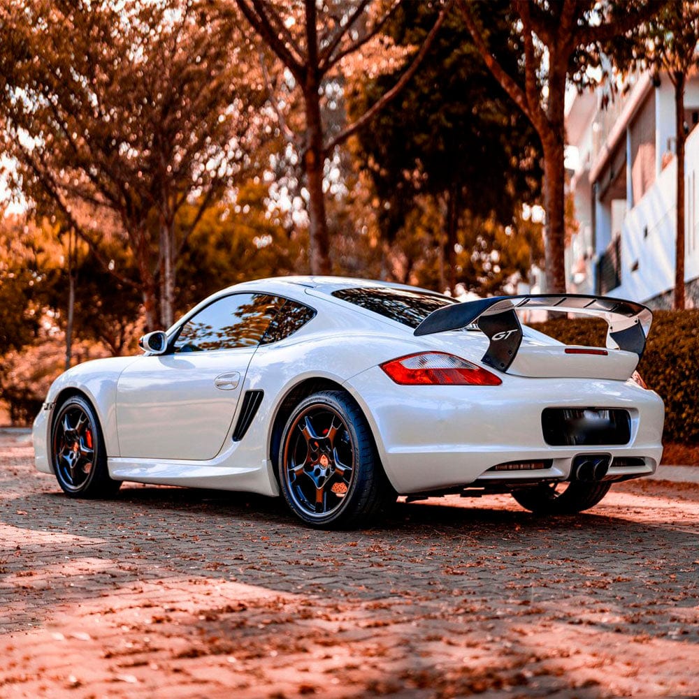 Side-angle view of a sports car wrapped in Teckwrap Light Blue Pearl (CK524-HD) gloss vinyl wrap, clearly emphasizing its glossy texture and sophisticated blue pearl highlights.