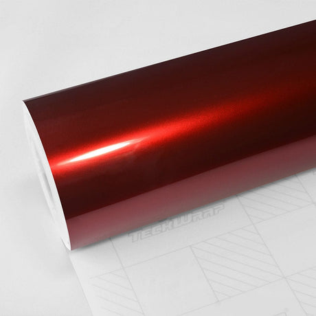 Close-up image of Supreme Red Gloss Metallic Vinyl Wrap (GAL26-HD) by TeckWrap, showcasing its vibrant deep red color, glossy metallic finish, and high reflective sheen on a roll, highlighting premium quality for vehicle customization.