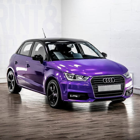 Audi wrapped in Midnight Purple (RB20-HD) Gloss Vinyl Wrap by TeckWrap, highlighting the color's vibrant gloss finish under indoor lighting.