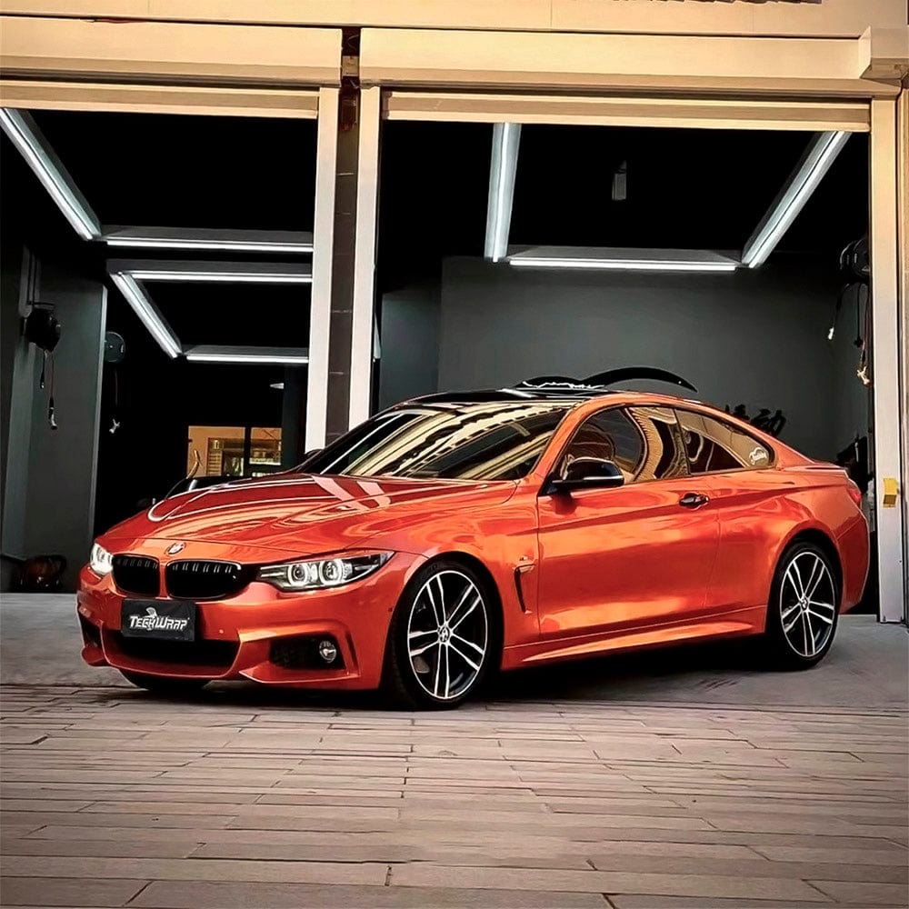 Luxury coupe wrapped with TeckWrap Glossy Paprika Orange (GAL06-HD) Vinyl, accentuating its sleek, dynamic curves