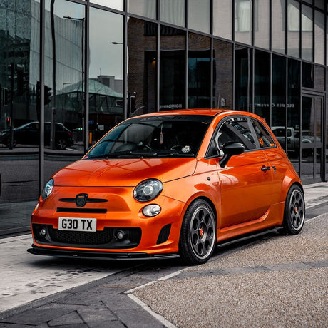 Compact car wrapped in TeckWrap Glossy Paprika Orange (GAL06-HD) Vinyl, demonstrating a sporty and stylish finish
