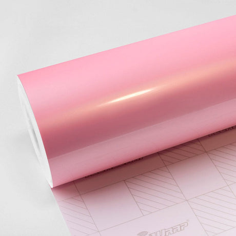 Pink Sakura Gloss Vinyl Wrap Roll by TeckWrap, showcasing a soft, vibrant pastel pink finish ideal for car customization and creative projects.