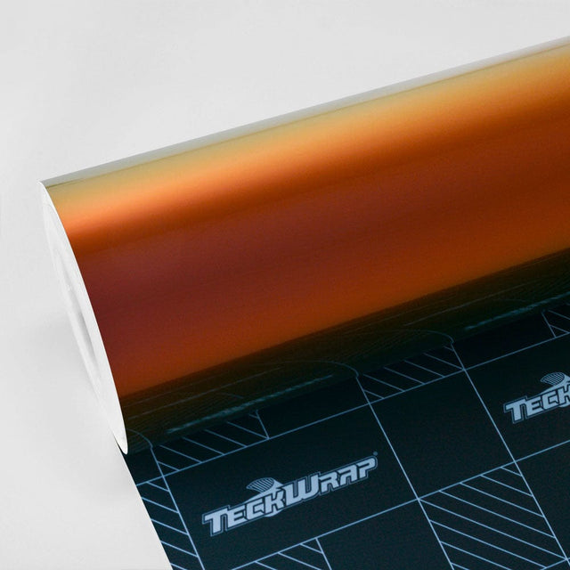 Roll of TeckWrap Ruby Gold (RD13-HD) Gloss Vinyl Wrap displaying vibrant metallic hues transitioning from deep ruby to luxurious gold.