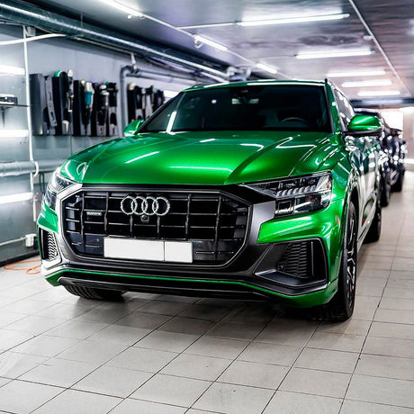 Audi car wrapped in TeckWrap Ruby Green (RB26-HD) Gloss Vinyl, emphasizing the brilliant reflective finish and luxurious green hue.