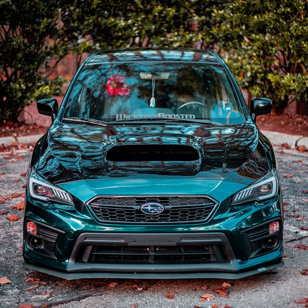 Front view of a Subaru wrapped in Teckwrap Sherwood Green vinyl, displaying the vinyl’s vibrant depth, mirror-like gloss, and striking teal-green color.