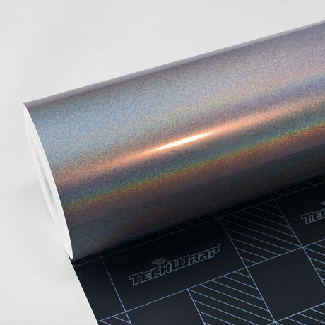 TeckWrap Silver Fireworks Gloss Vinyl Wrap (RCH01-HD) roll, showcasing a vibrant holographic sparkle effect ideal for distinctive car detailing.