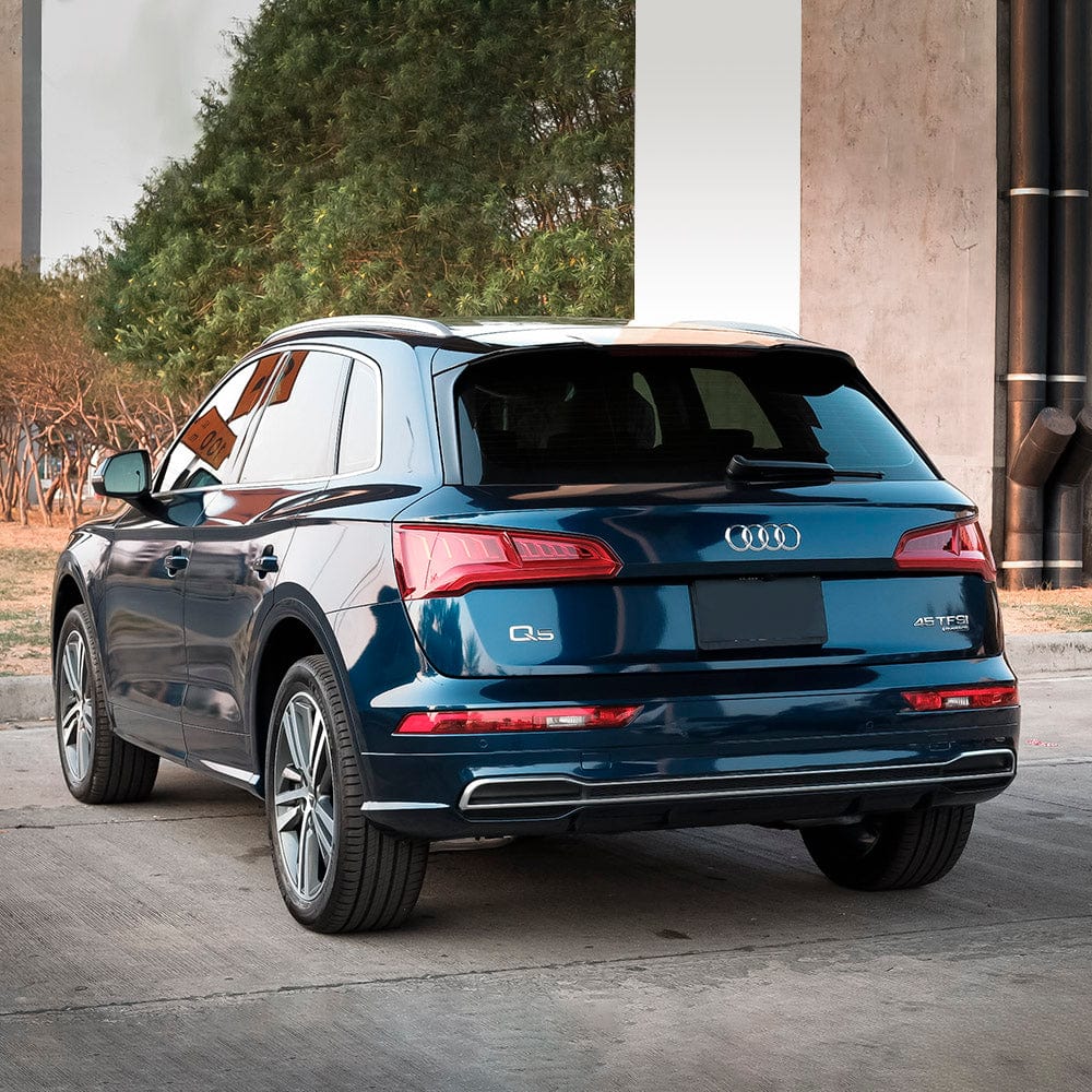 Audi SUV Rear View with Space Blue Gloss Vinyl – Rear perspective of an Audi SUV beautifully enhanced with TeckWrap’s Space Blue (GAL14-HD) gloss vinyl wrap, emphasizing its luxurious finish and impeccable reflective properties.