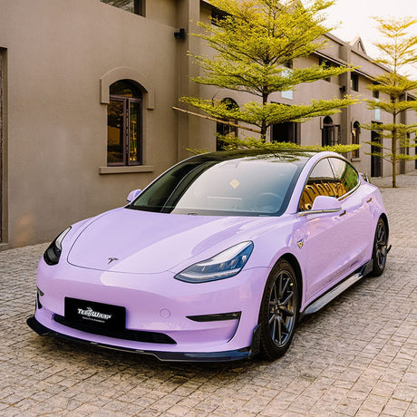 Tesla Model 3 wrapped in TeckWrap CG48-HD Spanish Lavender gloss vinyl parked in residential driveway
