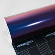 TeckWrap Violet Sunrise (RD14-HD) Gloss Vinyl Wrap Roll, displaying vibrant color shifts from violet to rich blue and violet tones.