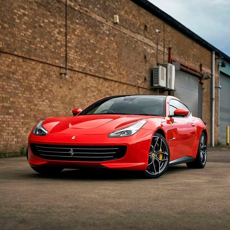 Luxury Ferrari featuring TeckWrap Racing Red High Gloss Vinyl Wrap, illustrating the intense, polished shine and bold, sporty appeal.